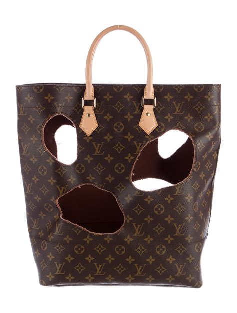 monogram bag with holes.